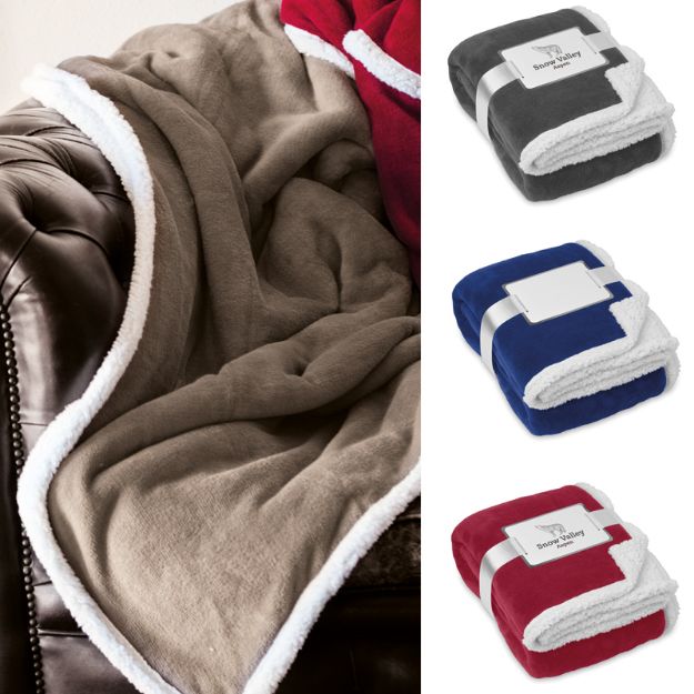 deken van koraal fleece met sherpa voering.