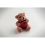 pluche teddybeer houdt rood hartje vast