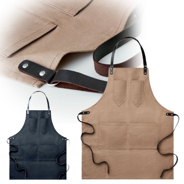 waxed canvas schort met leren details in de hals.