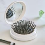 opvouwbare gerecyclede abs haarborstel met spiegel